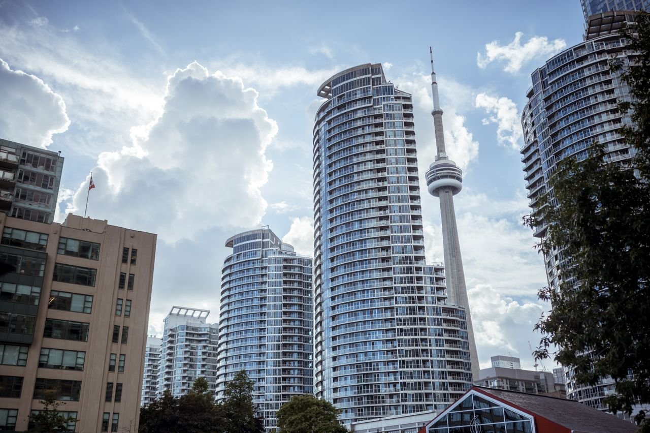 Stunning view of Torontos skyline with CN Tower under a cloudy sky.