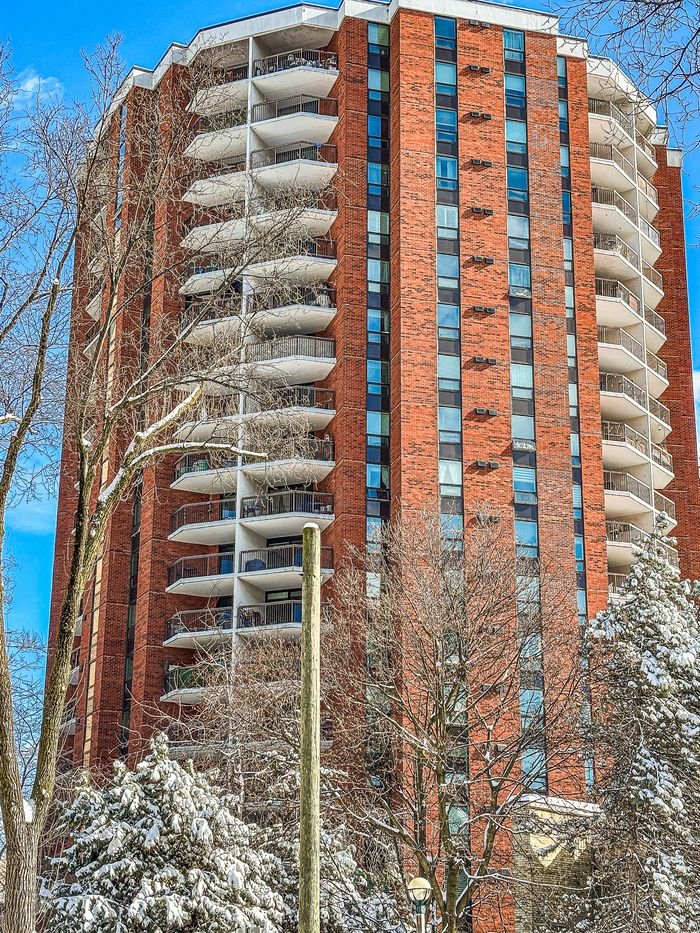 mission-img A modern high-rise building in downtown Toronto during winter season.